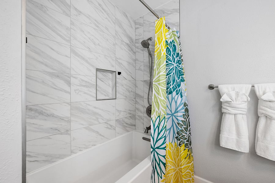 Spacious and stylish with double sinks, a bright LED mirror, and a full tub/shower combo.
