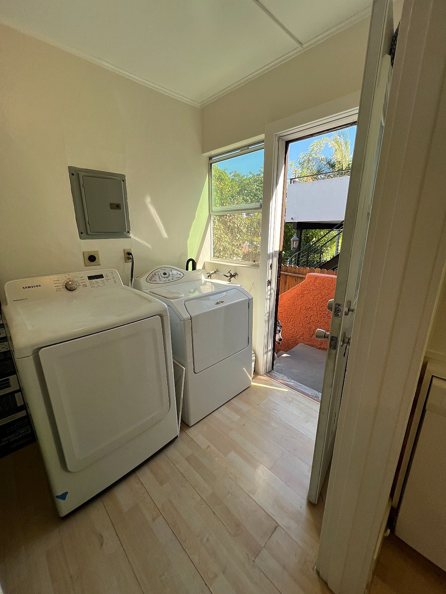 Washer dryer in the laundry room and side door to the yard. 