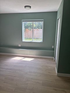 Lower level bedroom with window to backyard