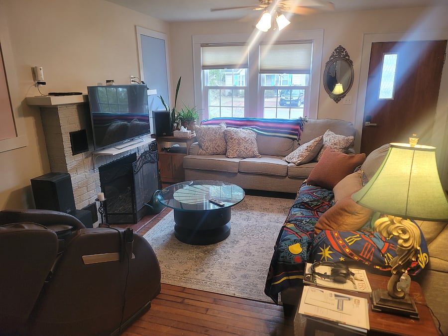 Living room with sunny window with privacy film.