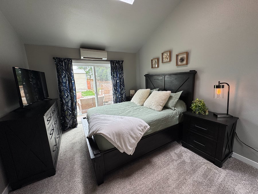 Private Bedroom with closet, dresser storage, full length mirror & sliding glass door to the patio!
