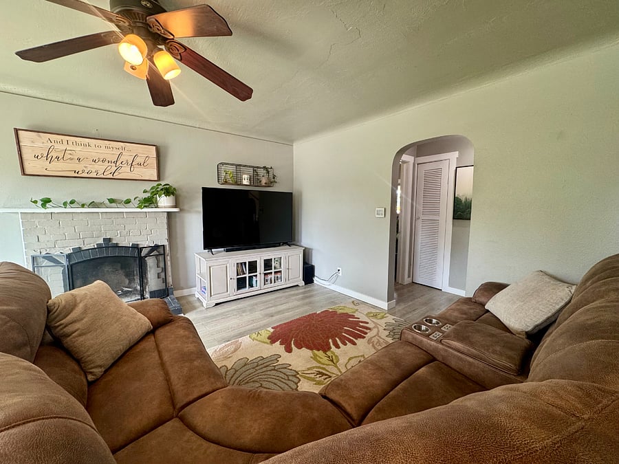 Comfortable reclining sectional with large tv and cozy living space!