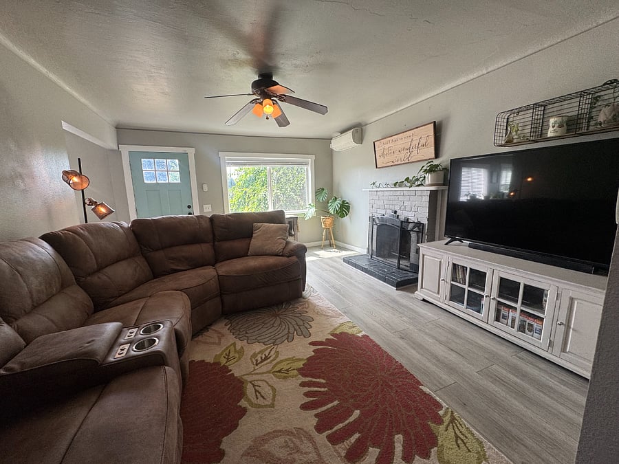 Comfortable reclining sectional with large tv and cozy living space!