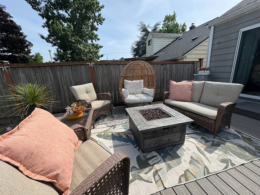 Relaxing outdoor deck with gas fire pit.