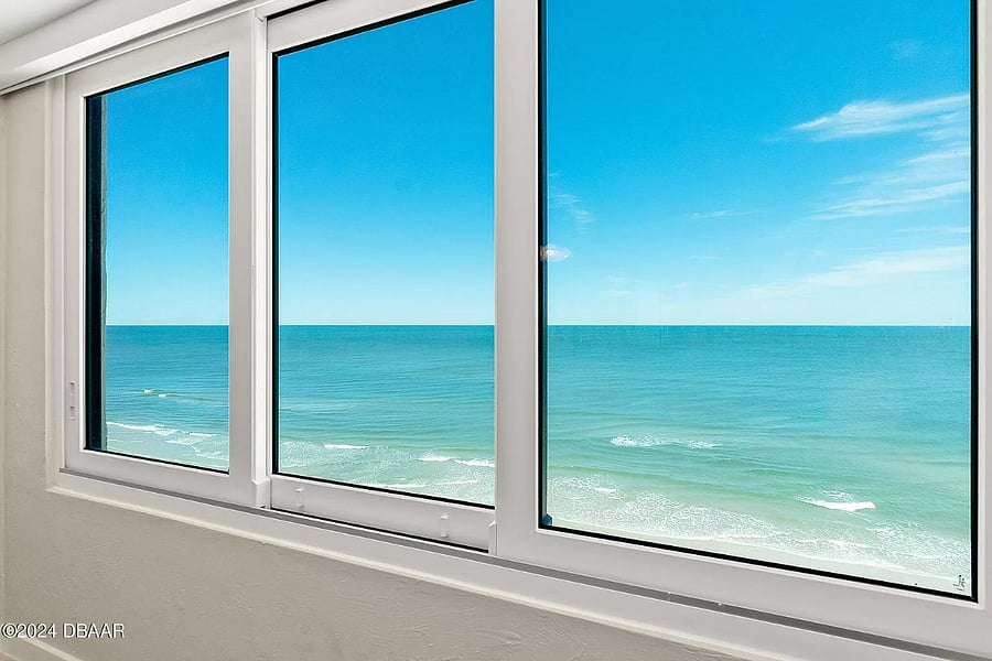 View from one of the bedrooms. Both of the bedrooms have windows that face the ocean and have king size beds