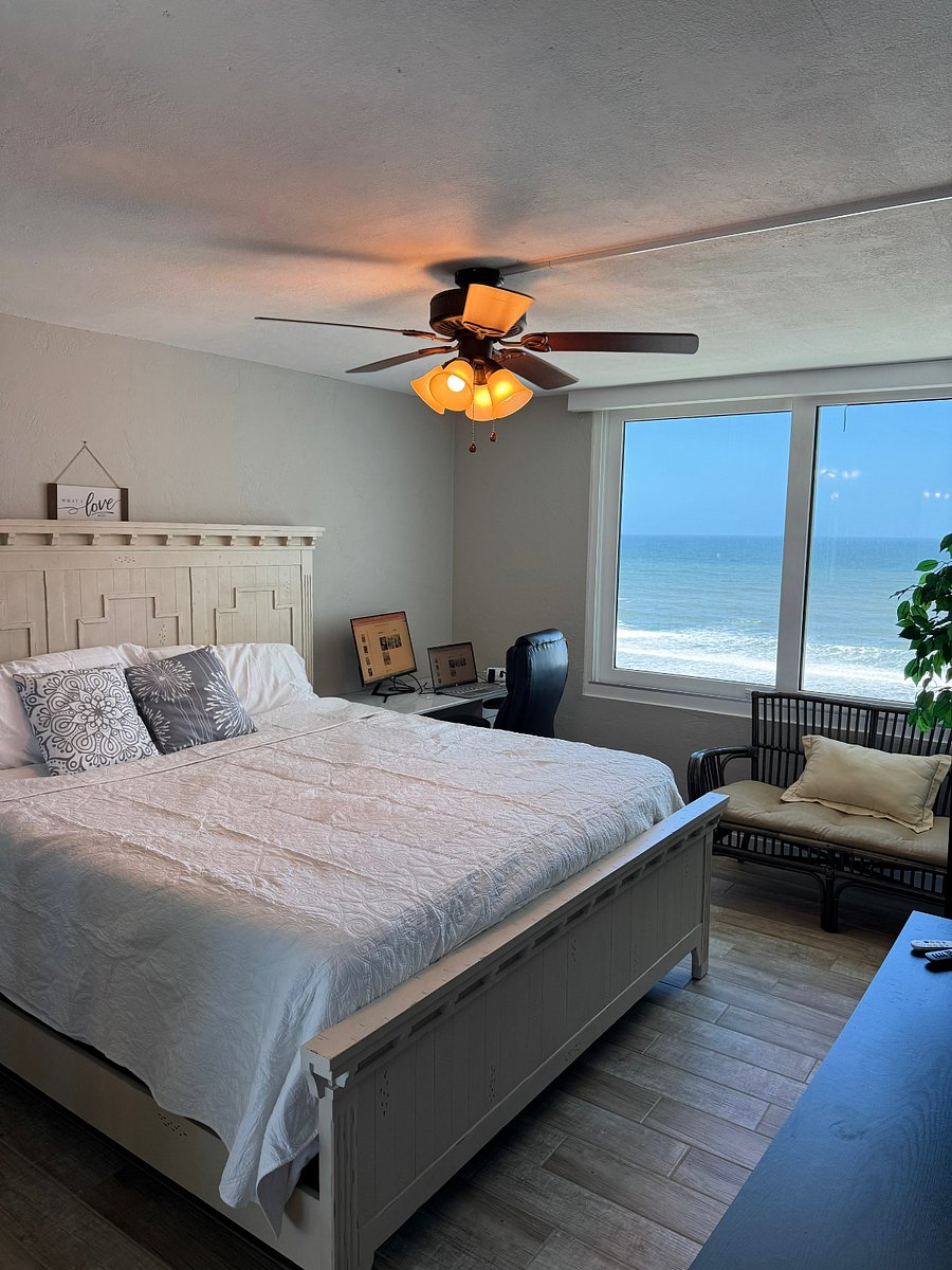 One of two bedrooms. Both have king size beds and a view of the ocean.. This room has a desk