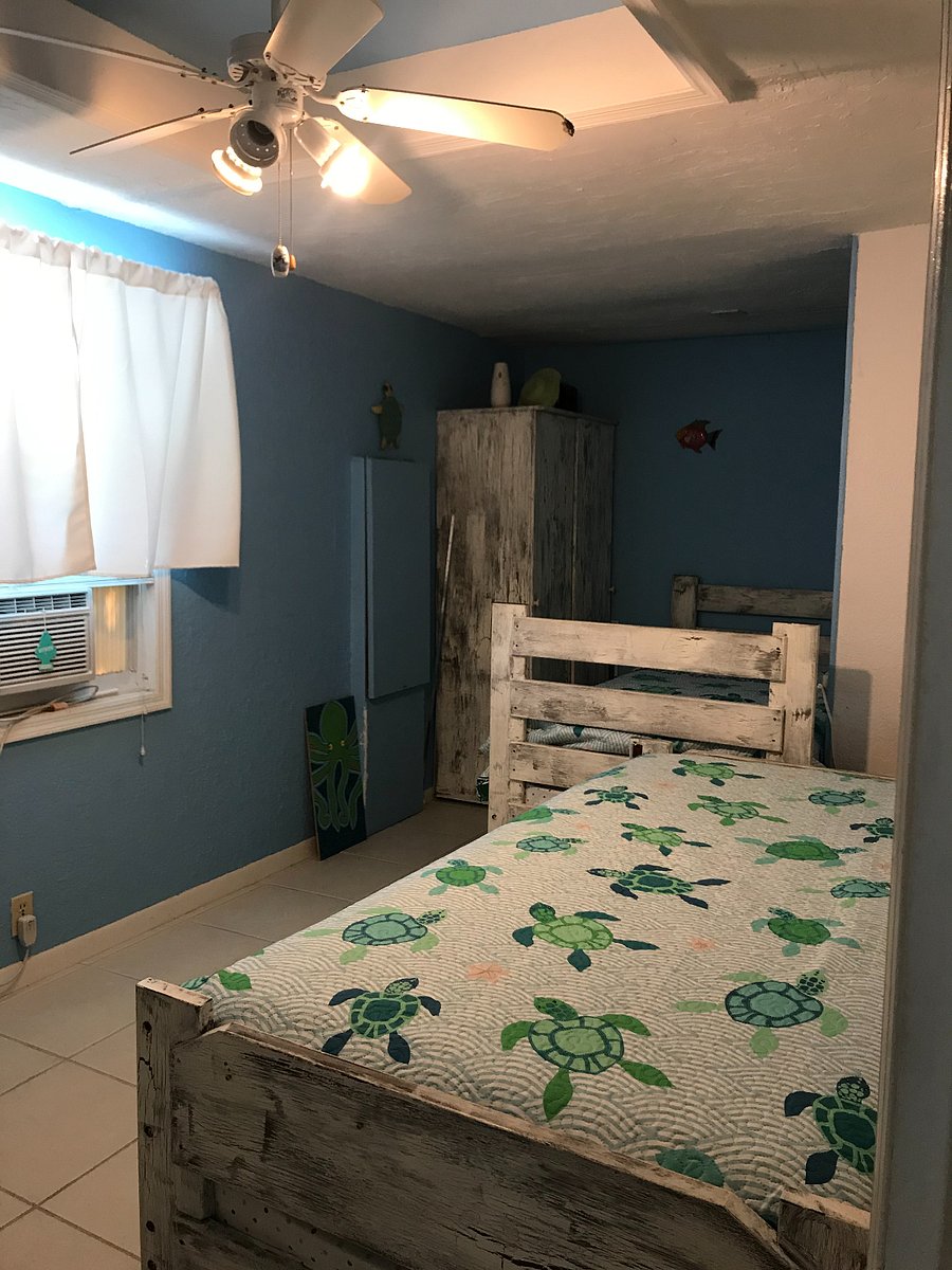 Twin Room-Two Twin beds (bunk beds disassembled), 1 Armoire with drawers storage inside, 1 window AC unit, ceiling fan
