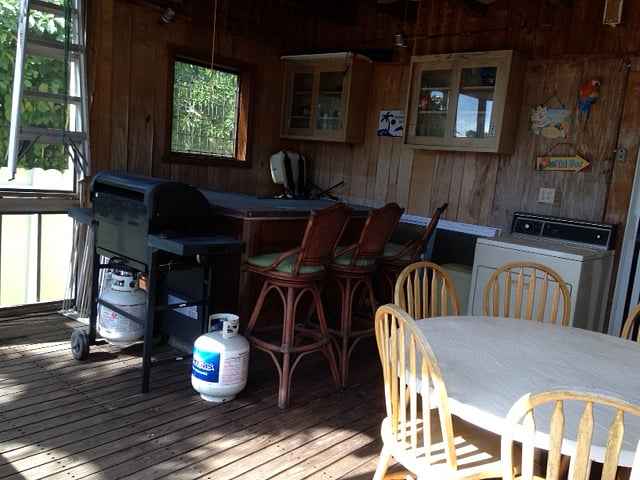 Back porch with Wet Bar  and table with seating for 6 and BBQ grill.  Also, not shown two lounge chairs 