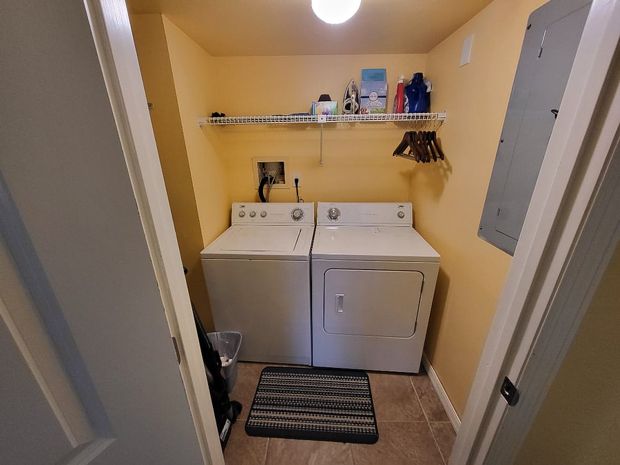 laundry room with door that closes for quiet comfort