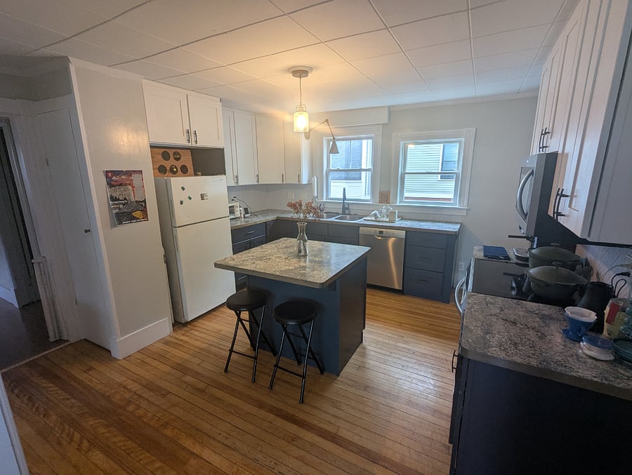 Full kitchen with dishwasher, stove, conduction range, microwave, espresso machine, toaster oven, and refrigerator.