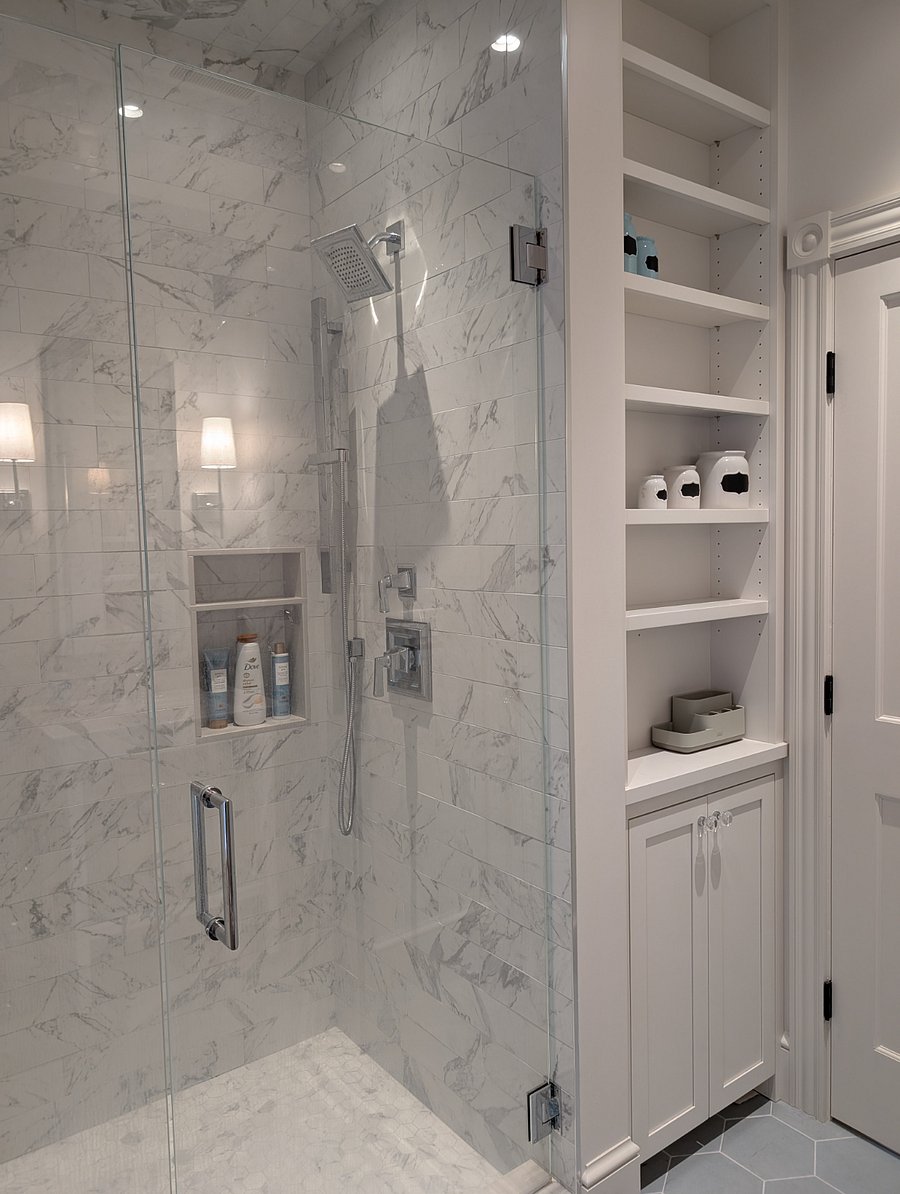 Large, tall shower with ample bathroom storage
