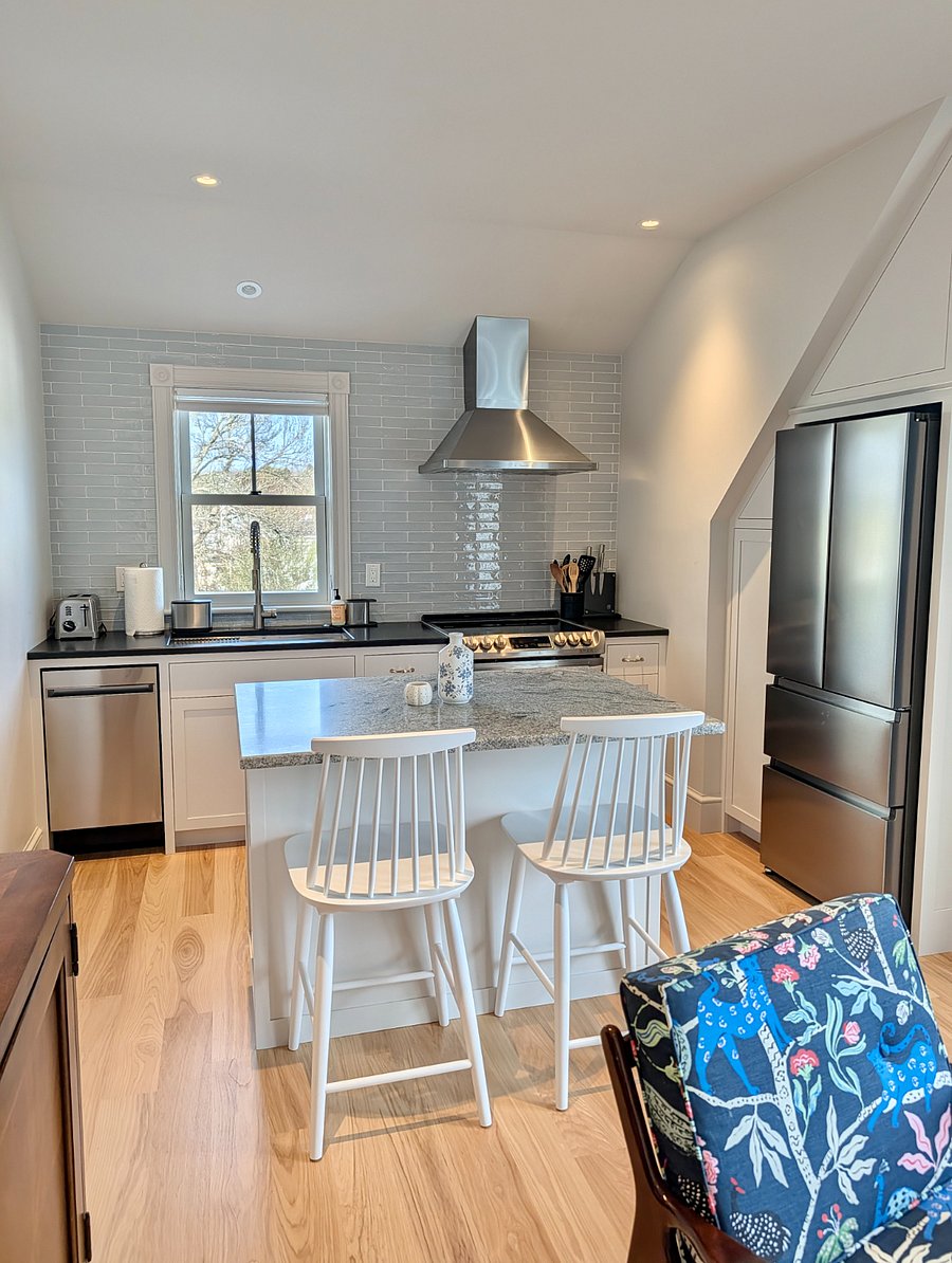 Functional kitchen with electric range and stone countertops