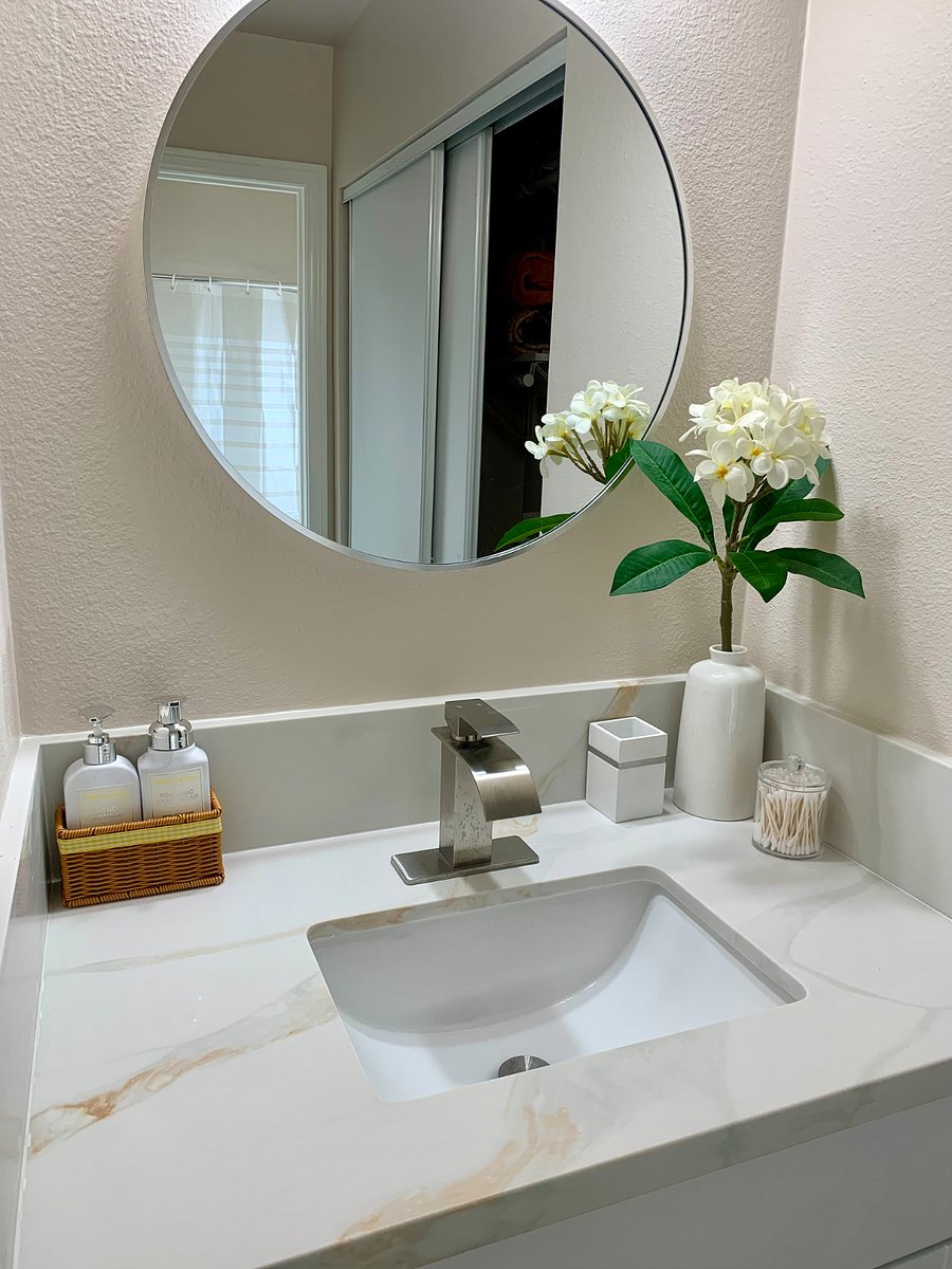 Bedroom 1 is complemented by new countertops and cabinetry, creating a modern, clean, and functional look that enhances both style and convenience.