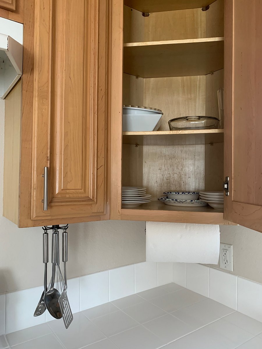 The kitchen is fully equipped with dishes, cups, silverware, and pans, providing everything you need to prepare and enjoy home-cooked meals during your stay.