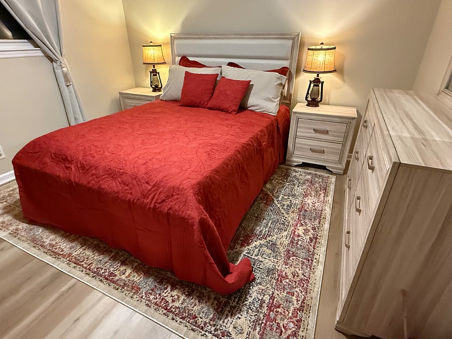 A brand new bureau and bedside tables provide storage for your items, and blackout curtains ensure peaceful sleep at any time of day.