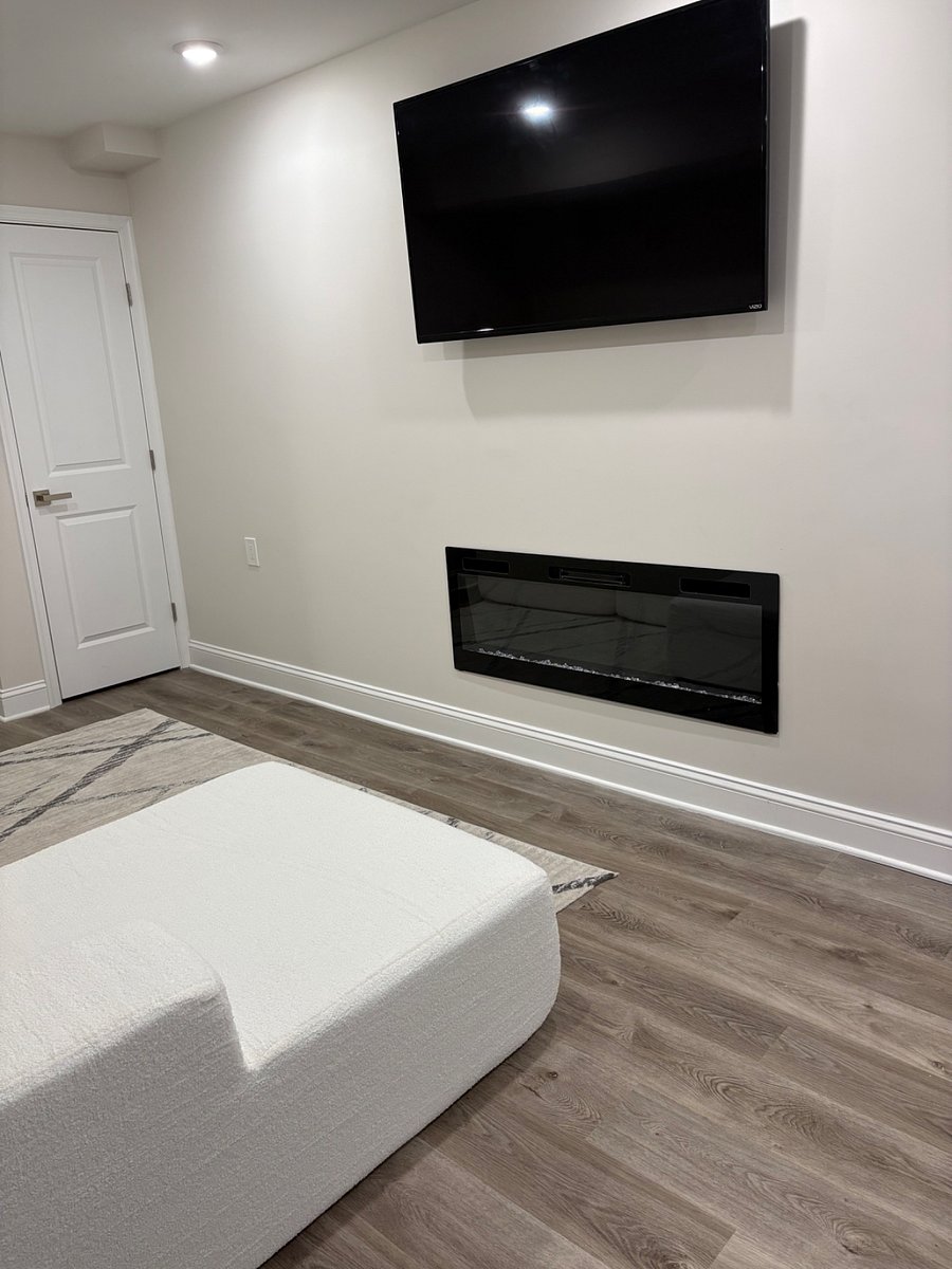 Living room with TV and electric fire place
