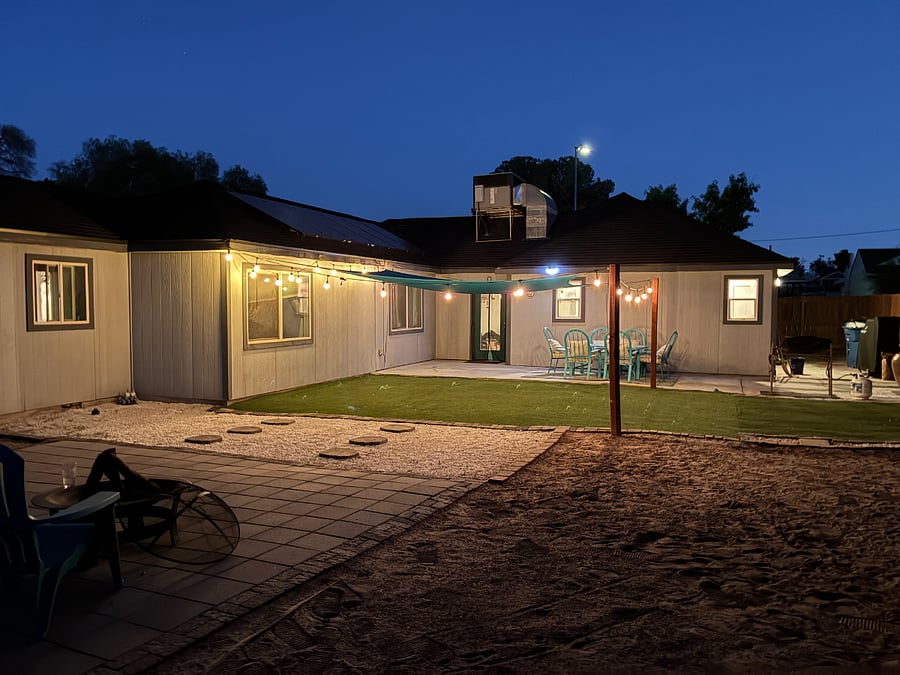 Bistro lights to enjoy the nights in this spacious backyard. 