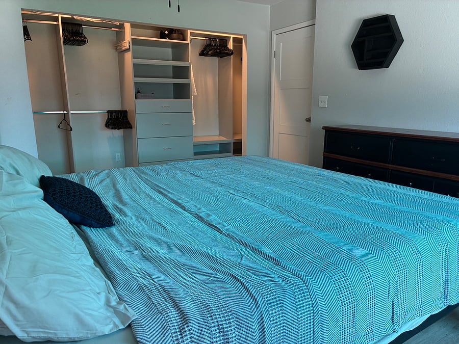 Master Bedroom is equipped with a spacious customized closet, drawers and dresser. 