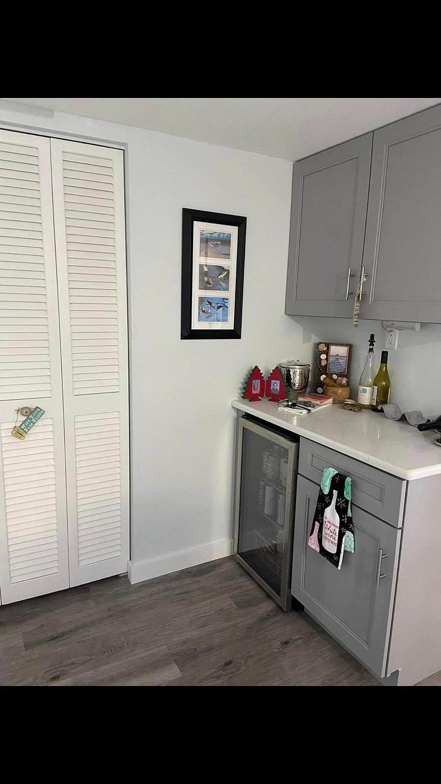 Front entryway with wine fridge.