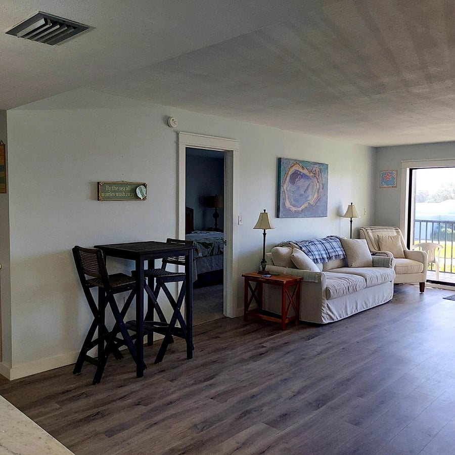 Living room, master bedroom door opening on left