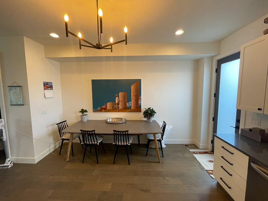 Large 8 person kitchen table in the kitchen. 