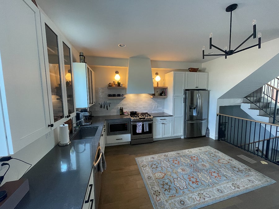 another shot of the kitchen, lots of storage and space, very open.