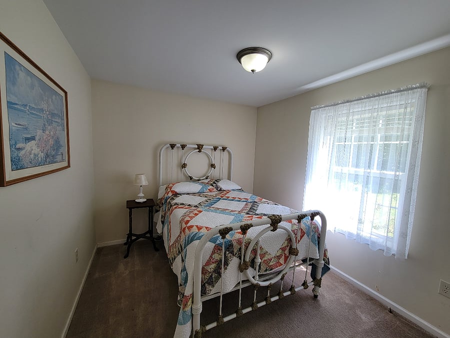 Third bedroom with antique double bed.