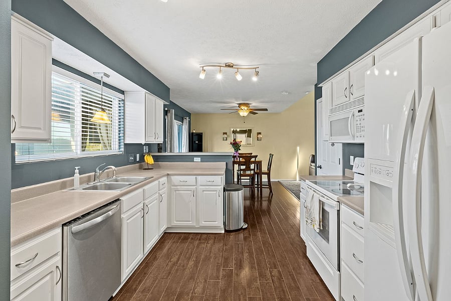 Kitchen near pantry, laundry and bathroom.