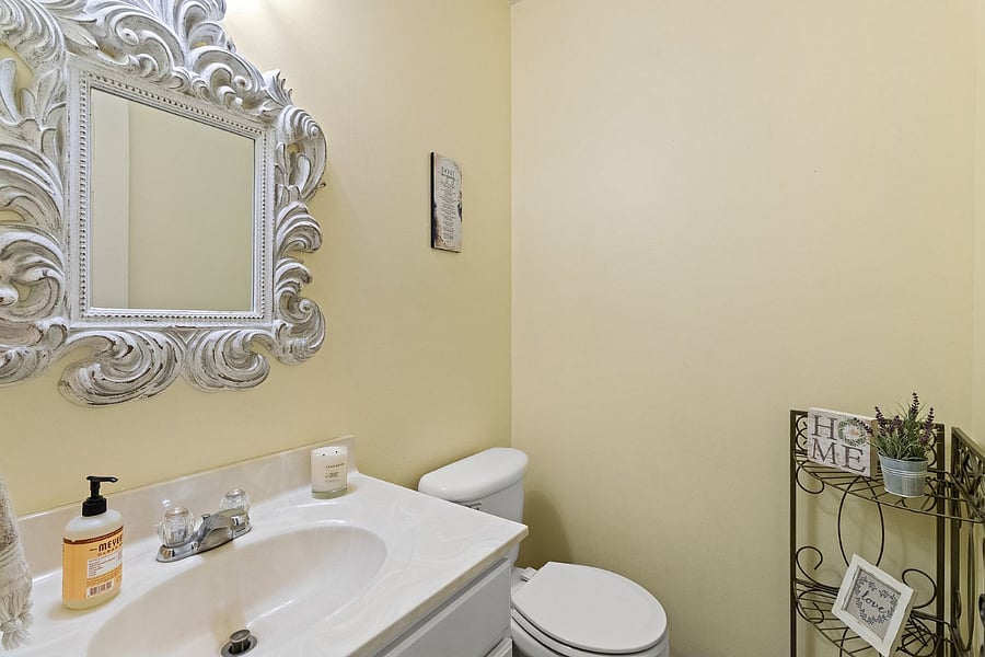 Main level bathroom attached to kitchen area.