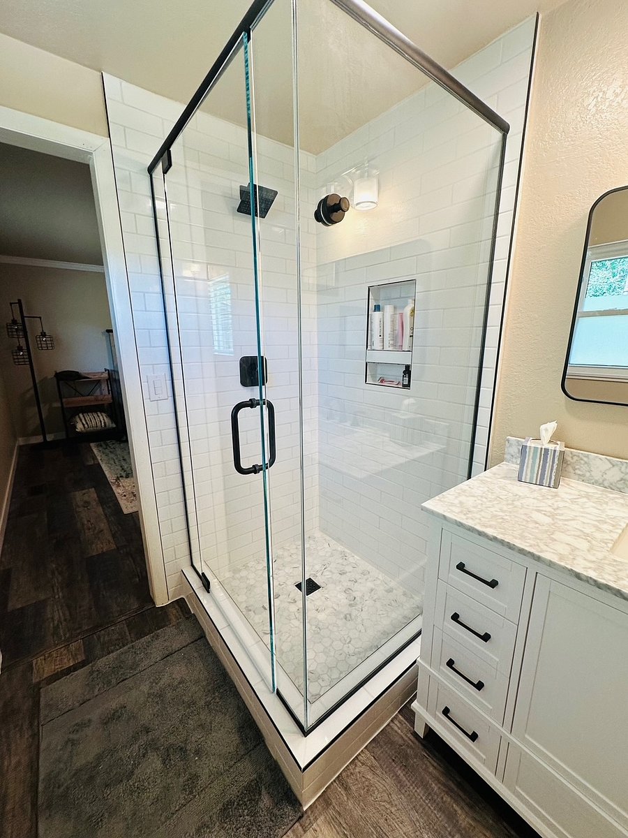 Bathroom off Main bedroom with custom tiled, glass enclosed shower