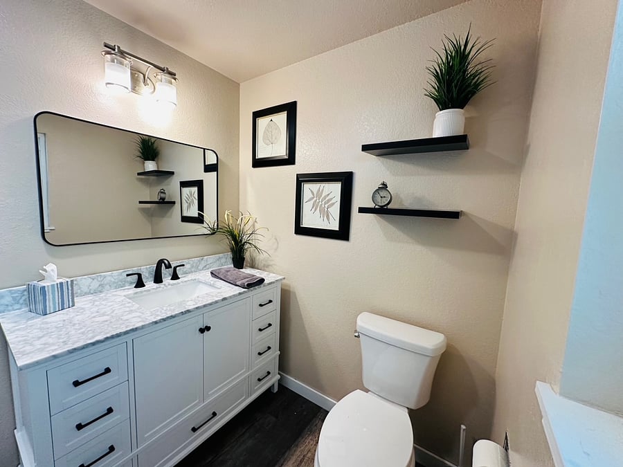 Bathroom off Main bedroom with new vanity, flooring and toilet