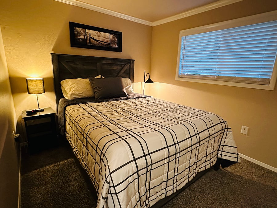 Second room with Queen sized bed and two night stands