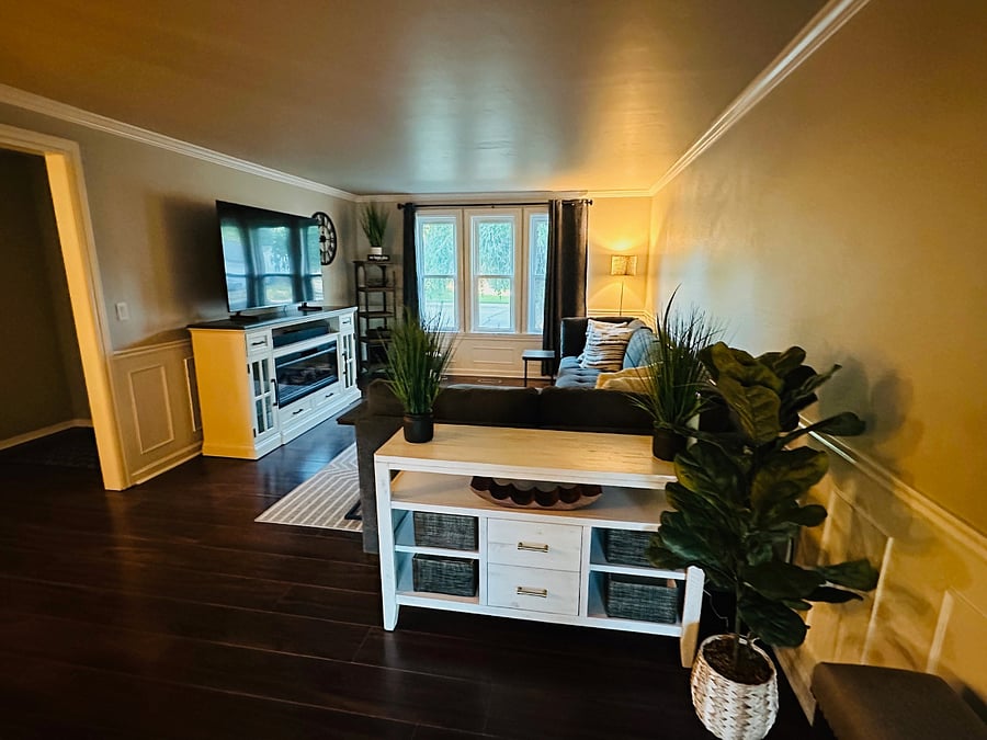Stylish new furniture with white accents in the main living room for a clean and simple feel