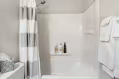 Hall bathroom with tub, shower