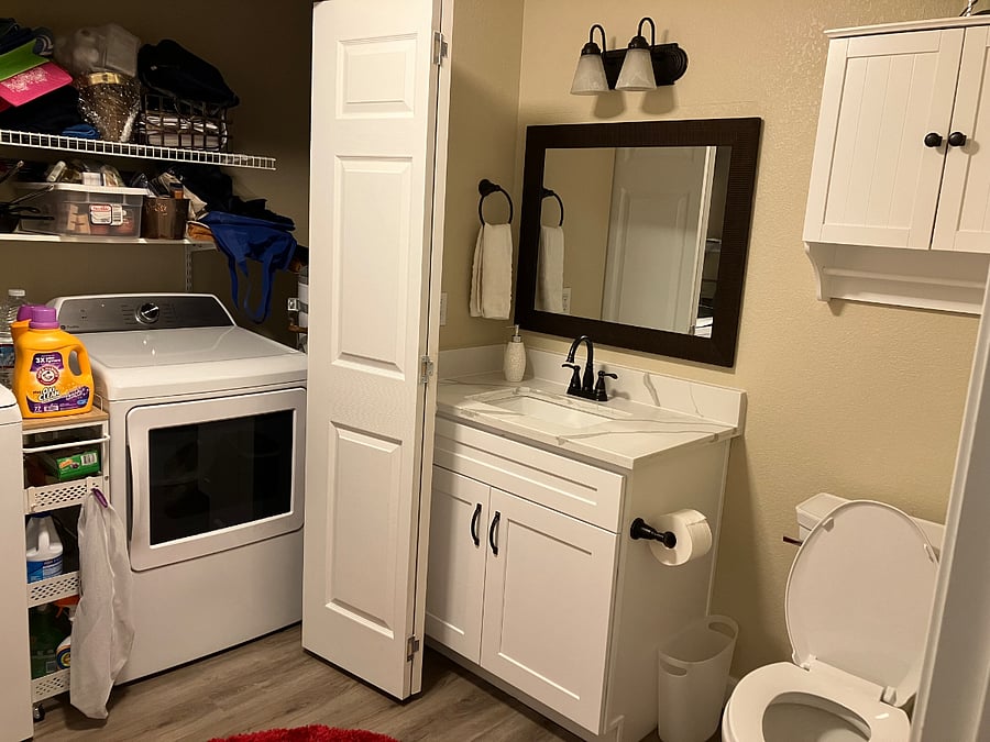 This is the half bath downstairs. It houses the W/D in a closet. This bathroom is also fully remodeled and the W/D are new.