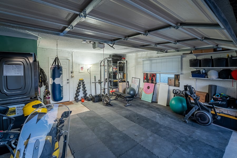 Garage to include gym, washer/dryer and half bathroom