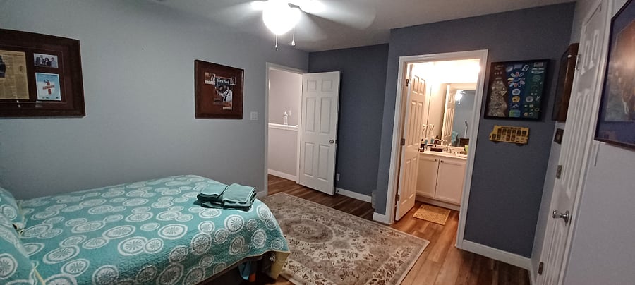 Bed room with private full bathroom.