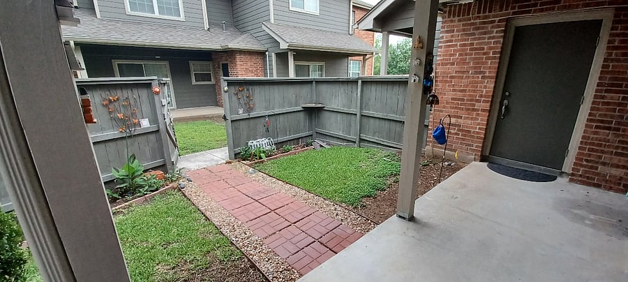 Fenced Patio/ garden. Entrance to sliding door.