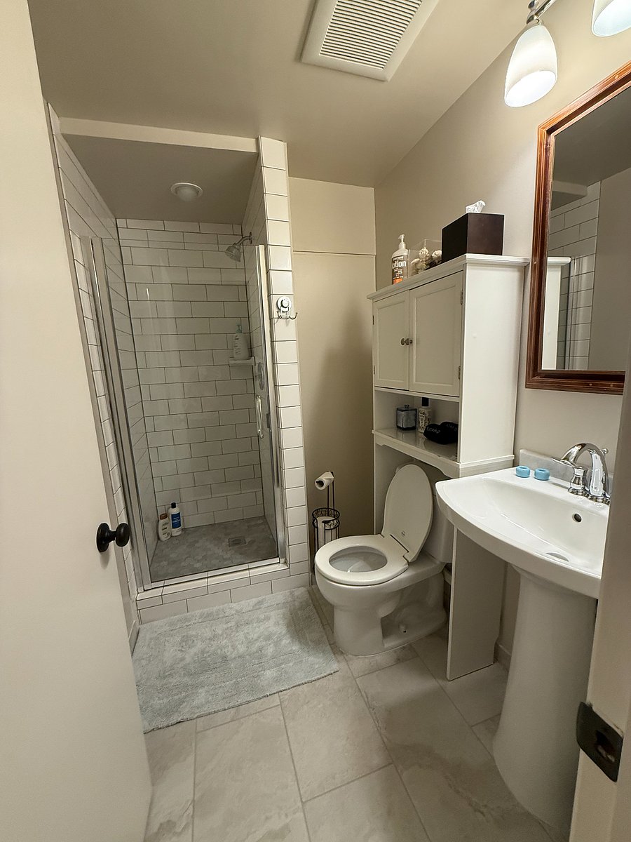 Bathroom - newly renovated with heated tile flooring, a heated towel rack and freshly painted walls