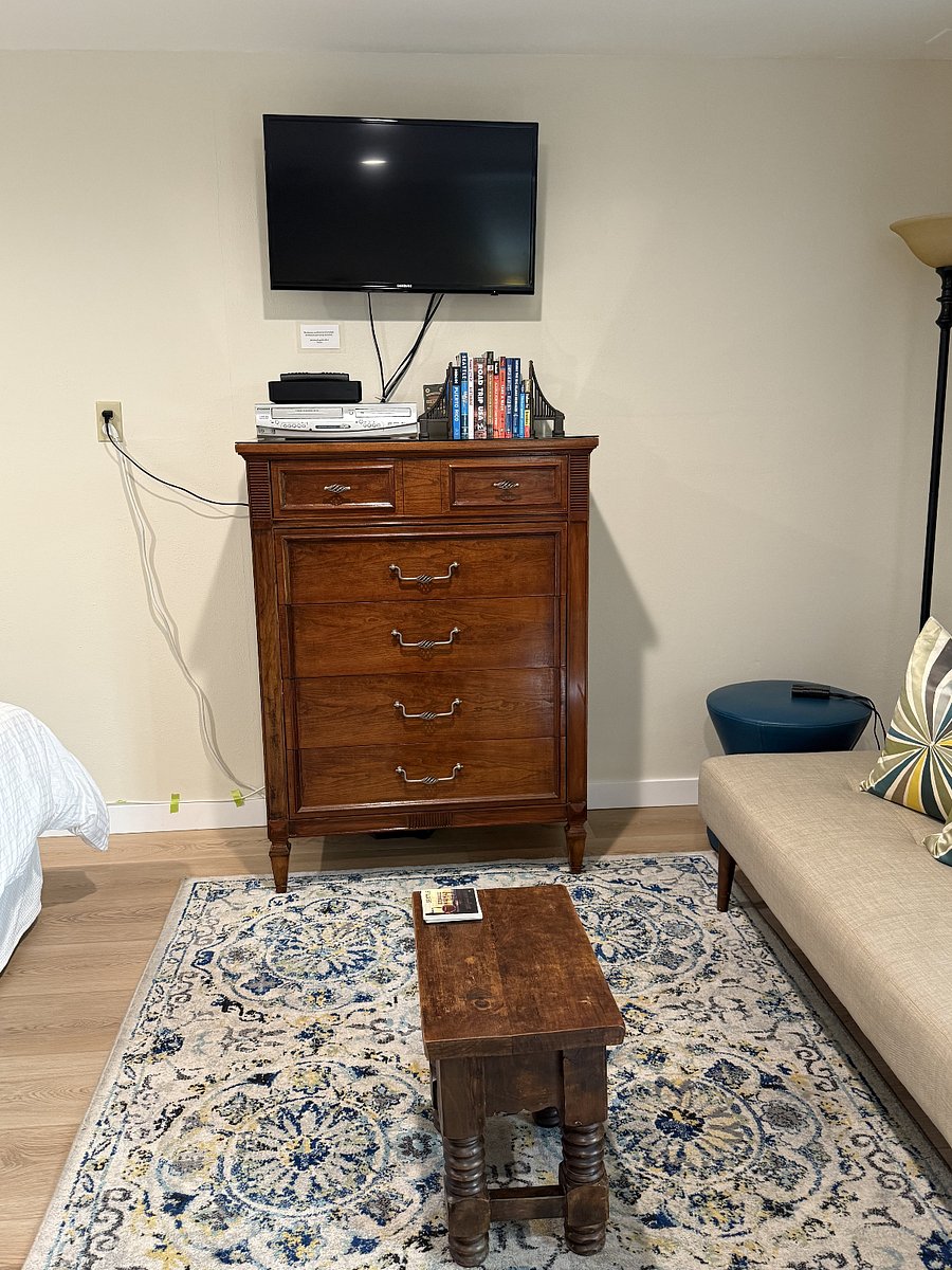 Dresser and wall-mounted, swivel-able TV
