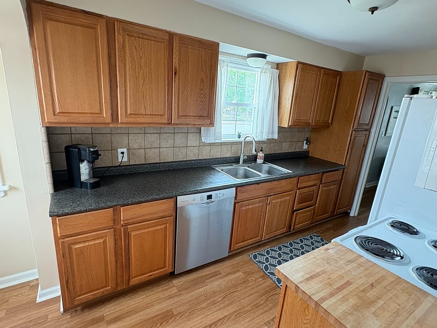 Kitchen includes full size refrigerator, Bosch dishwasher and plenty of storage
