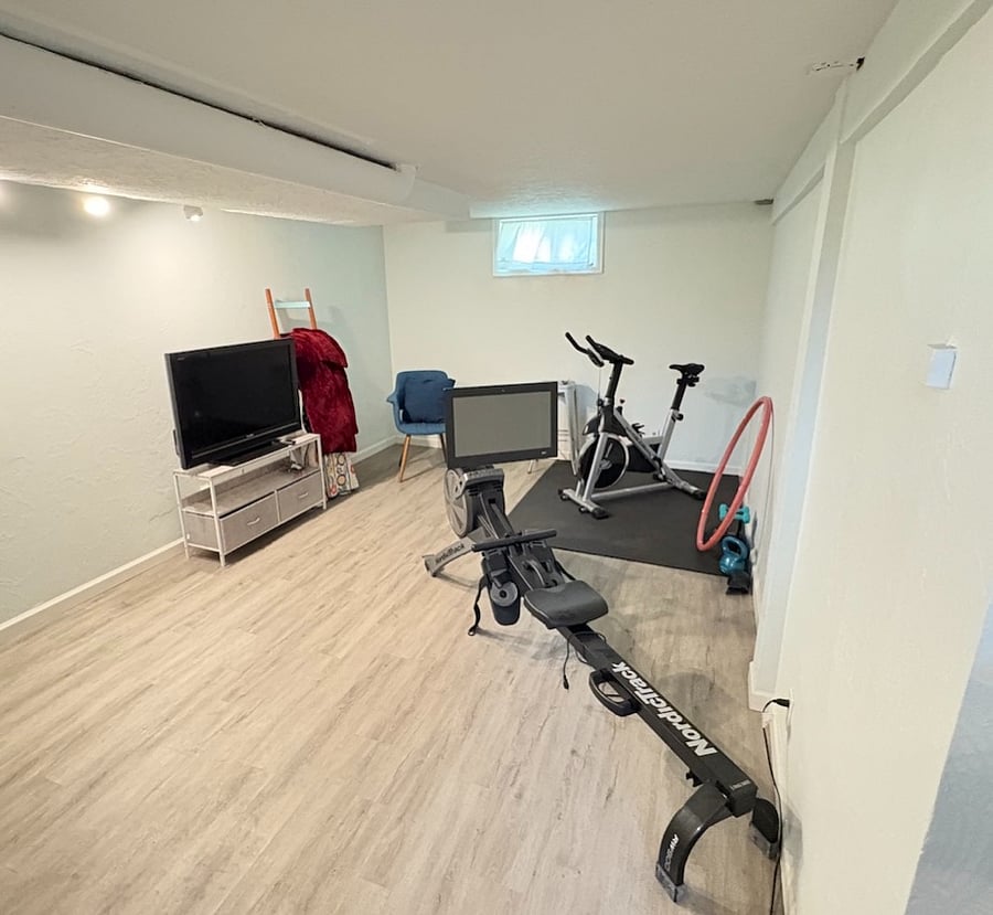 Gym includes rower, stationary bike, wighted hula hoop, 1 kettle bell and 3 sets of dumbbells.