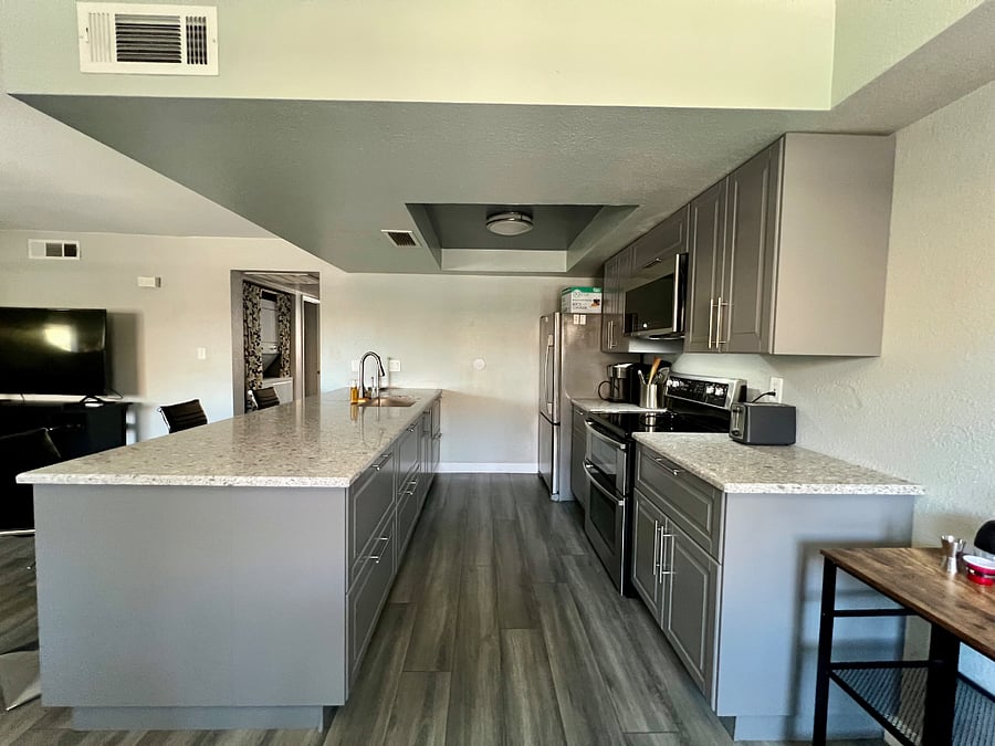 Kitchen with lots of storage options and ample countertop space with an oversized peninsula.