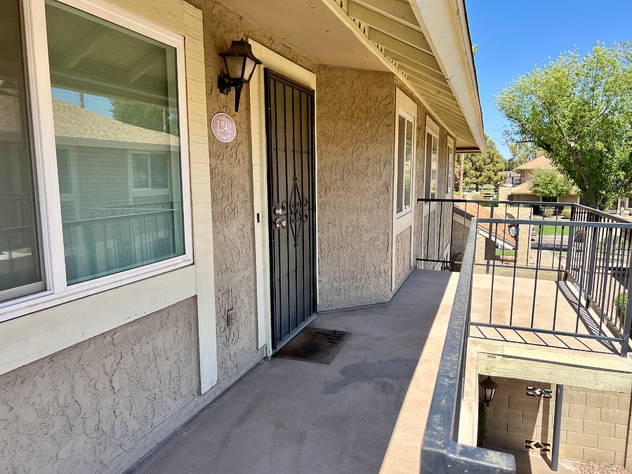 Front door with patio area.