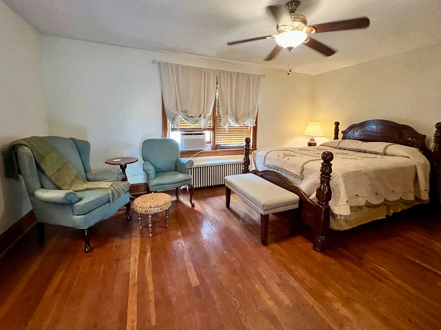 Queen bedroom. Private. Includes: Roku TV, hair dryer, bed linens, window AC, ceiling fan, towel hanger, shoe tray, shower caddy.