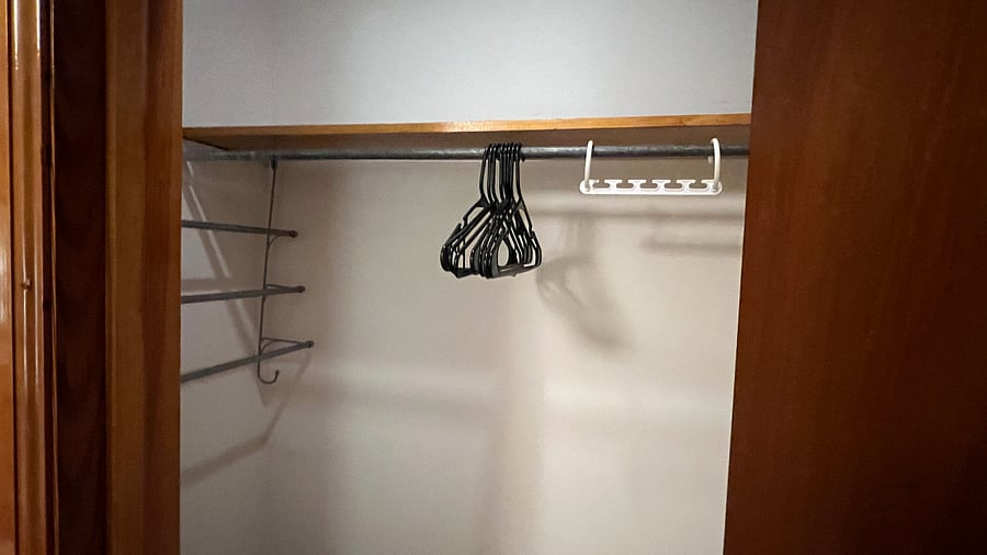 Closet, laundry basket, shower caddy with silicone drip tray, and various hangers.