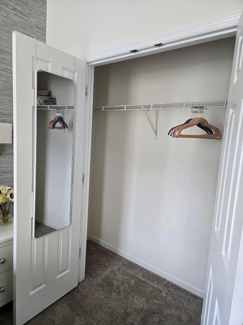 One bedroom offers a spacious closet with hangers and extra linen for your stay. With a full-length mirror as a bonus!