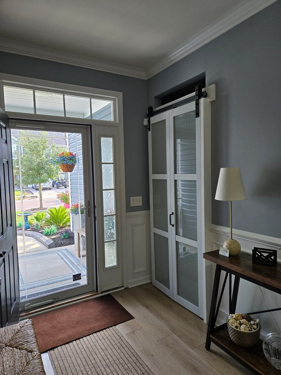 Step into the entryway through the beautiful barn door into your private suite that includes a full bedroom, full bathroom, living area with coffee bar and desk.