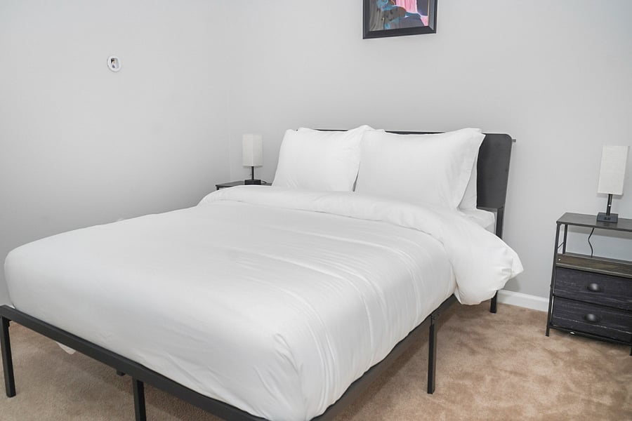 Room B (full-size bed) - Drift off to sleep in this cozy, peaceful bedroom, featuring a plush mattress and soft, clean linens. Thoughtfully designed with bedside lamps and plenty of space to unwind and recharge.