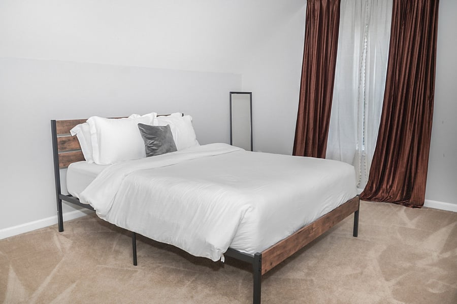 Room C (queen-size bed) Unwind in this bright and airy bedroom, styled with soothing tones and a soft, comfortable bed. A large window with elegant curtains lets in plenty of natural light while still ensuring your privacy.